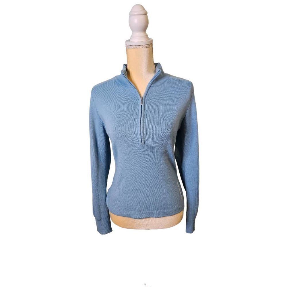 Nordica ski sweater, 3/4 zip, light blue with a white stripe down the sleeves. S